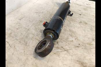 salg af New Holland T6070  Front axle steering cylinder